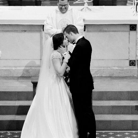 Isabelle Butker and her husband Harrison Butker were photographed as they shared their first kiss as husband and wife.